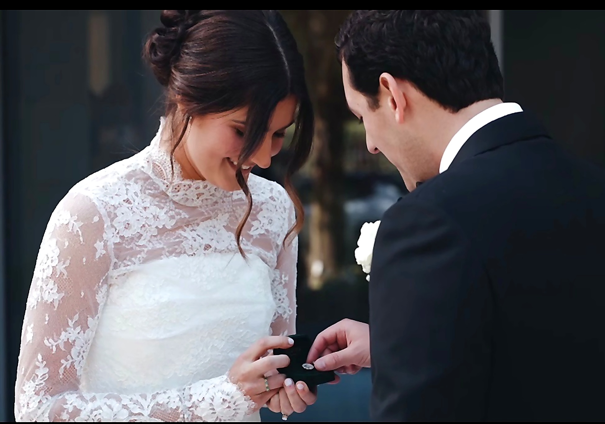 A bride's hand and ring detail.